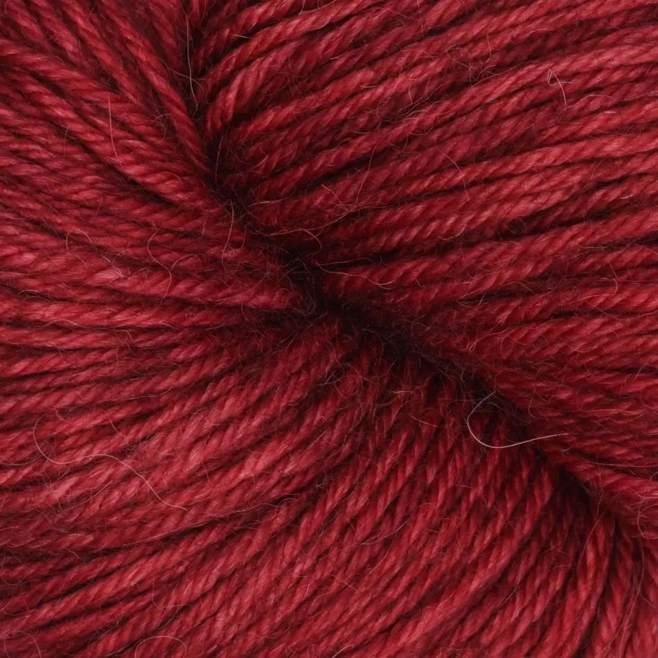 100g skein of Symfonie Serra yarn in Red Fall