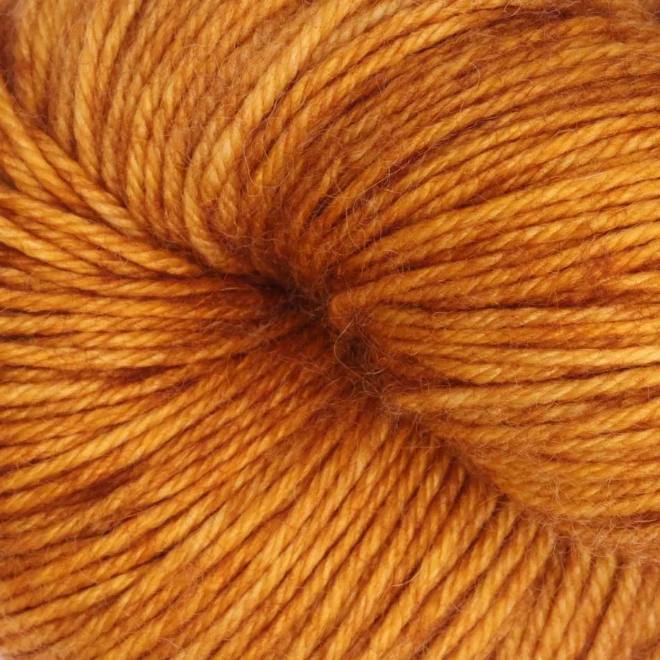 100g skein of Symfonie Serra yarn in Deep Amber