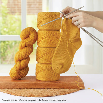 Skein of Symfonie Yarns Terra sock yarn in Turmeric