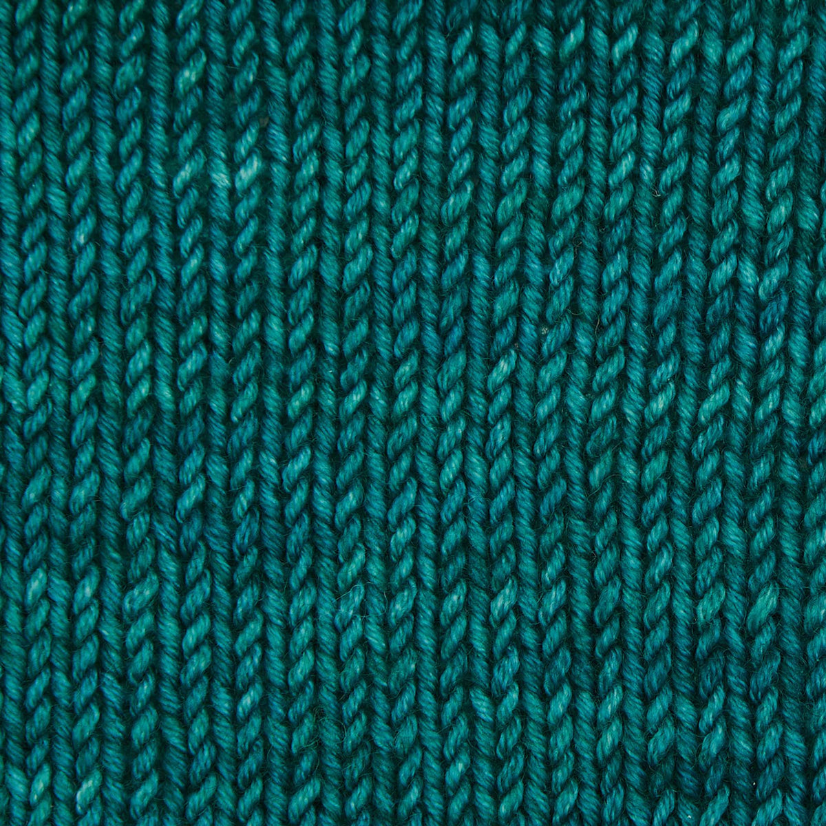 Skein of Symfonie Viva DK merino yarn in Peacock Green