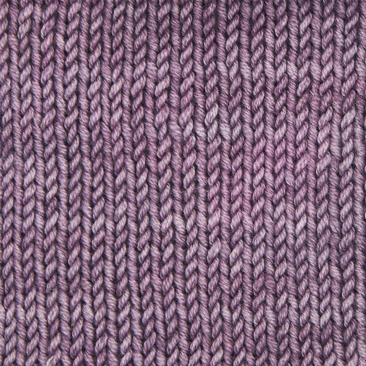 Skein of Symfonie Viva DK merino yarn in Purple Sea Glass