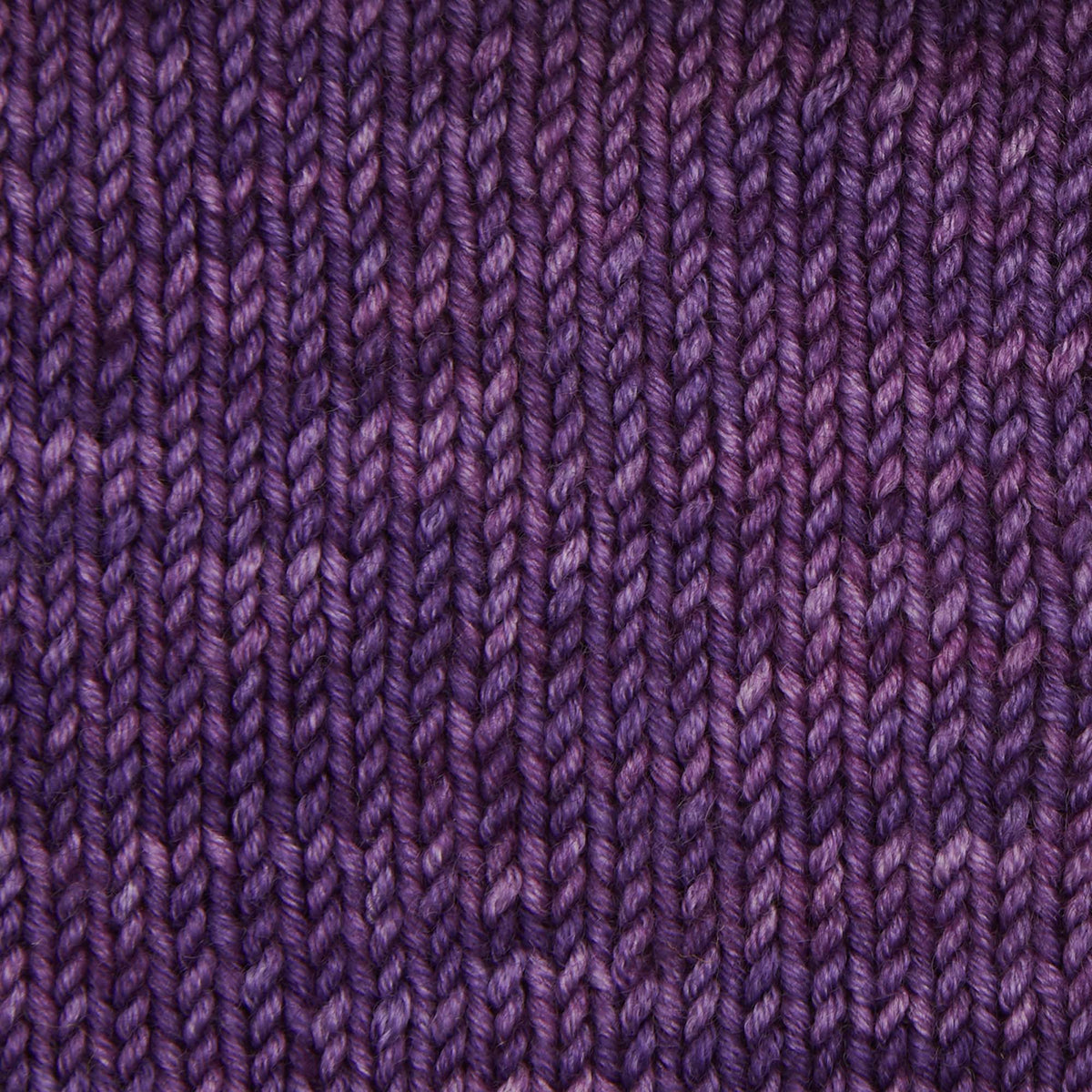Skein of Symfonie Viva DK merino yarn in Amethyst
