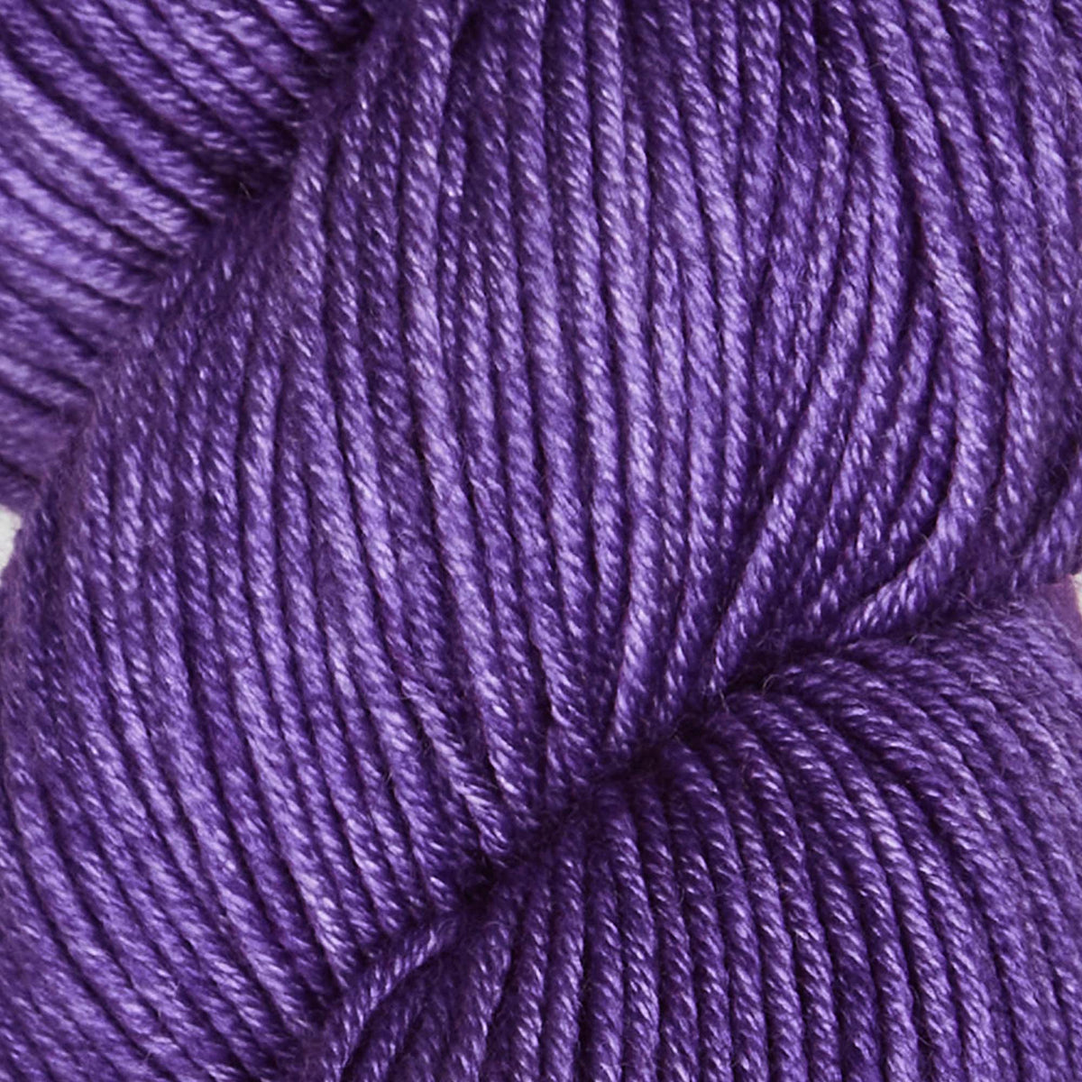 Skein of Symfonie Viva DK merino yarn in Amethyst