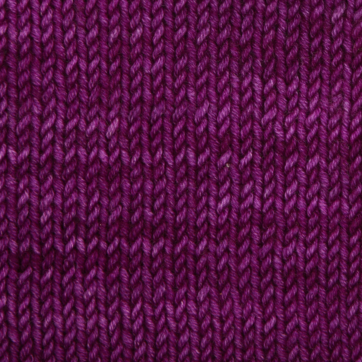 Skein of Symfonie Viva DK merino yarn in Purple Fuchsia