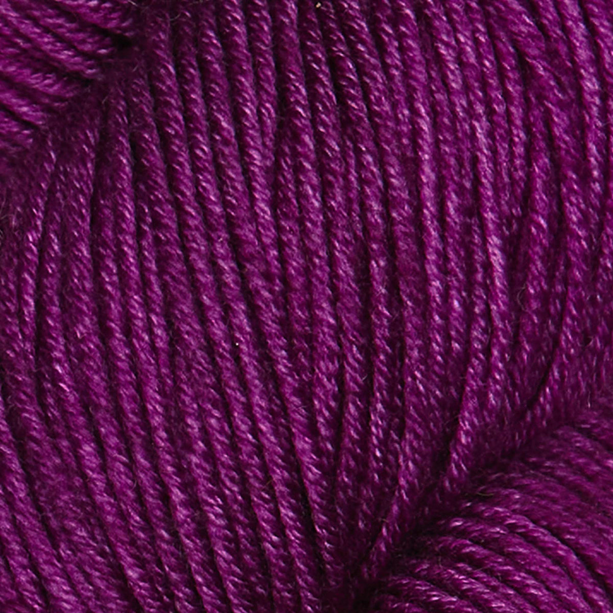 Skein of Symfonie Viva DK merino yarn in Purple Fuchsia