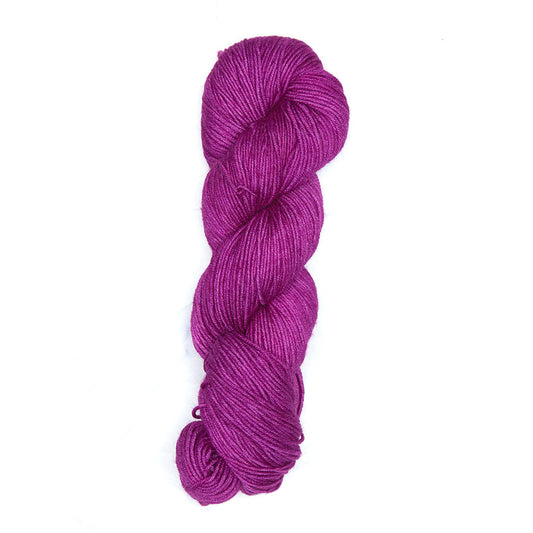 Skein of Symfonie Viva DK merino yarn in Purple Fuchsia