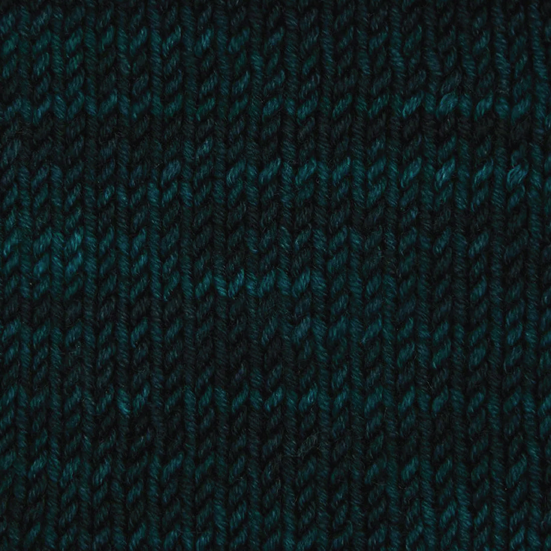 Skein of Symfonie Viva DK merino yarn in Midnight Forest