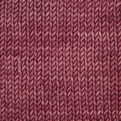 Skein of Symfonie Viva DK merino yarn in Bougainvillea