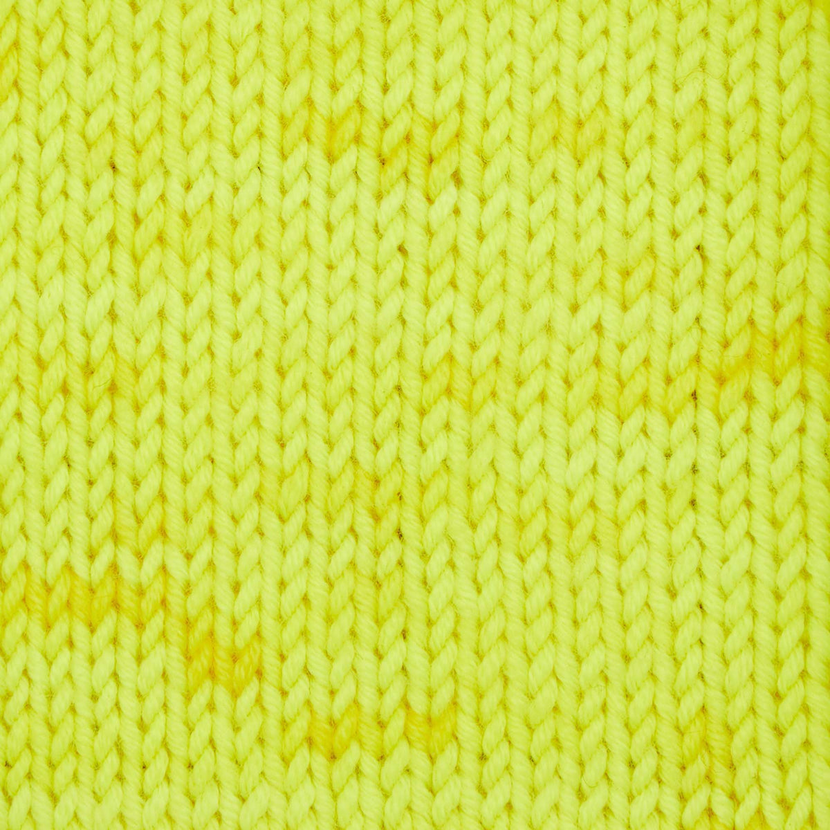 Skein of Symfonie Viva DK merino yarn in Lemon Glow