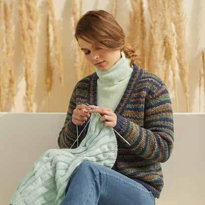 Skein of Symfonie Viva DK merino yarn in Riverbank