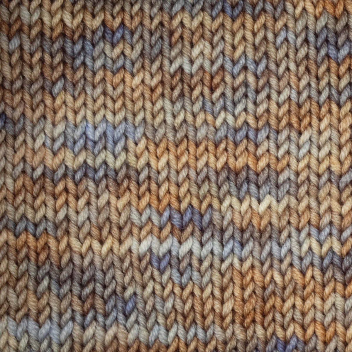 Skein of Symfonie Viva DK merino yarn in Blue Dune