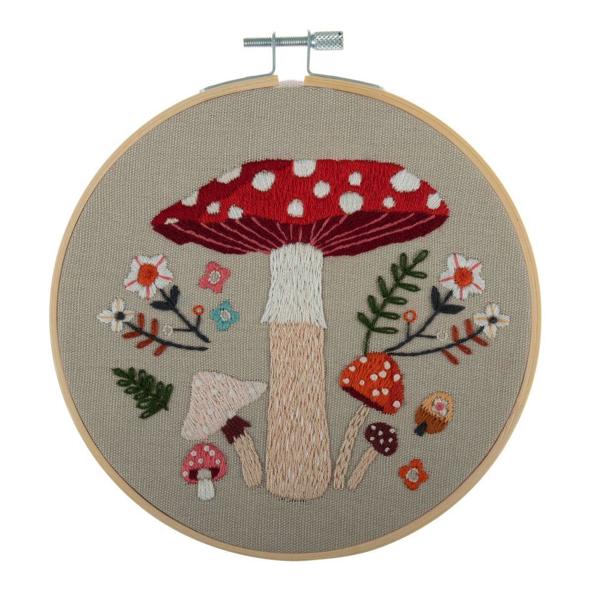 Embroidery hoop kit showing a stitched toadstool design