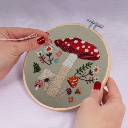 Embroidery hoop kit showing a stitched toadstool design