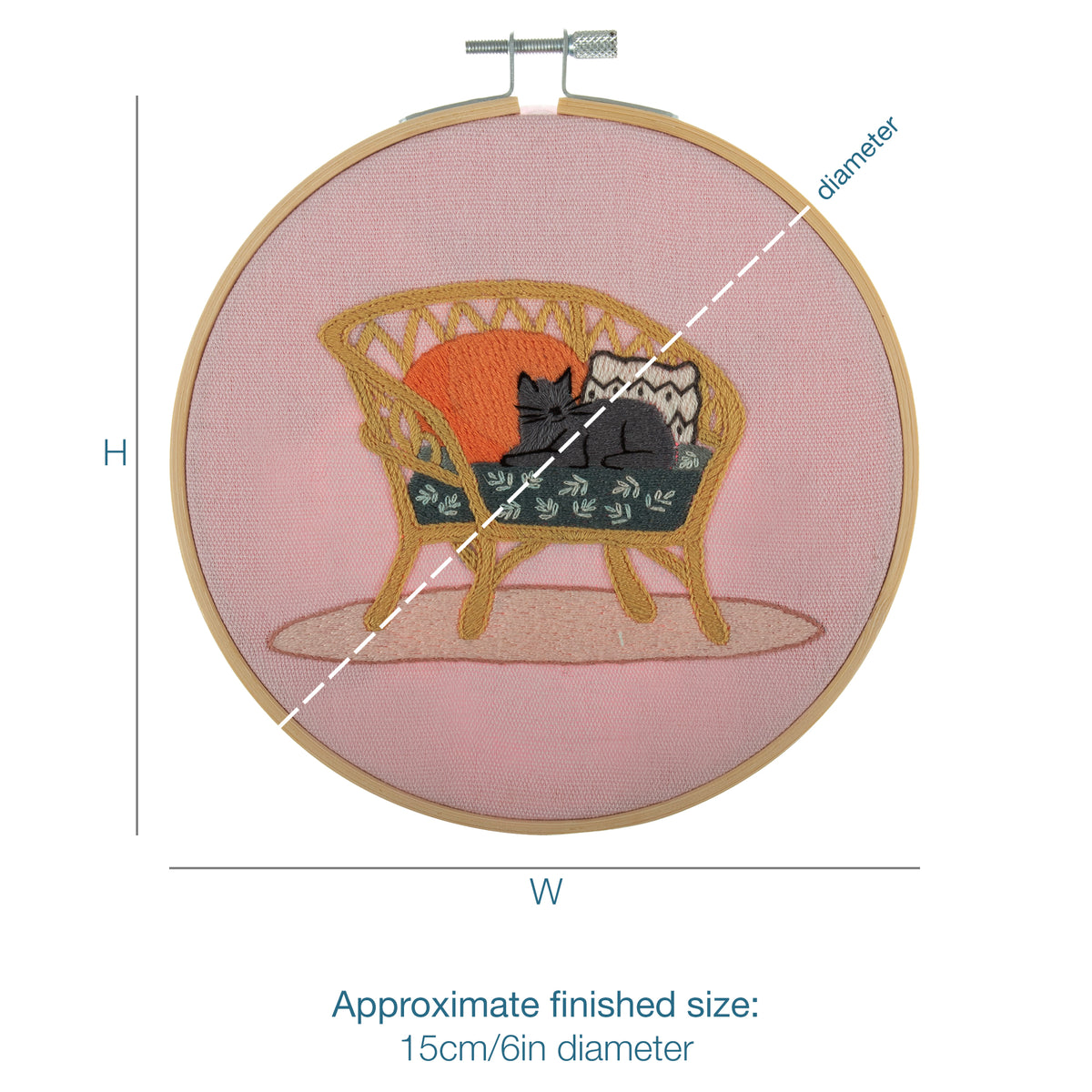 Embroidery hoop kit showing a stitched cat on wicker chair design