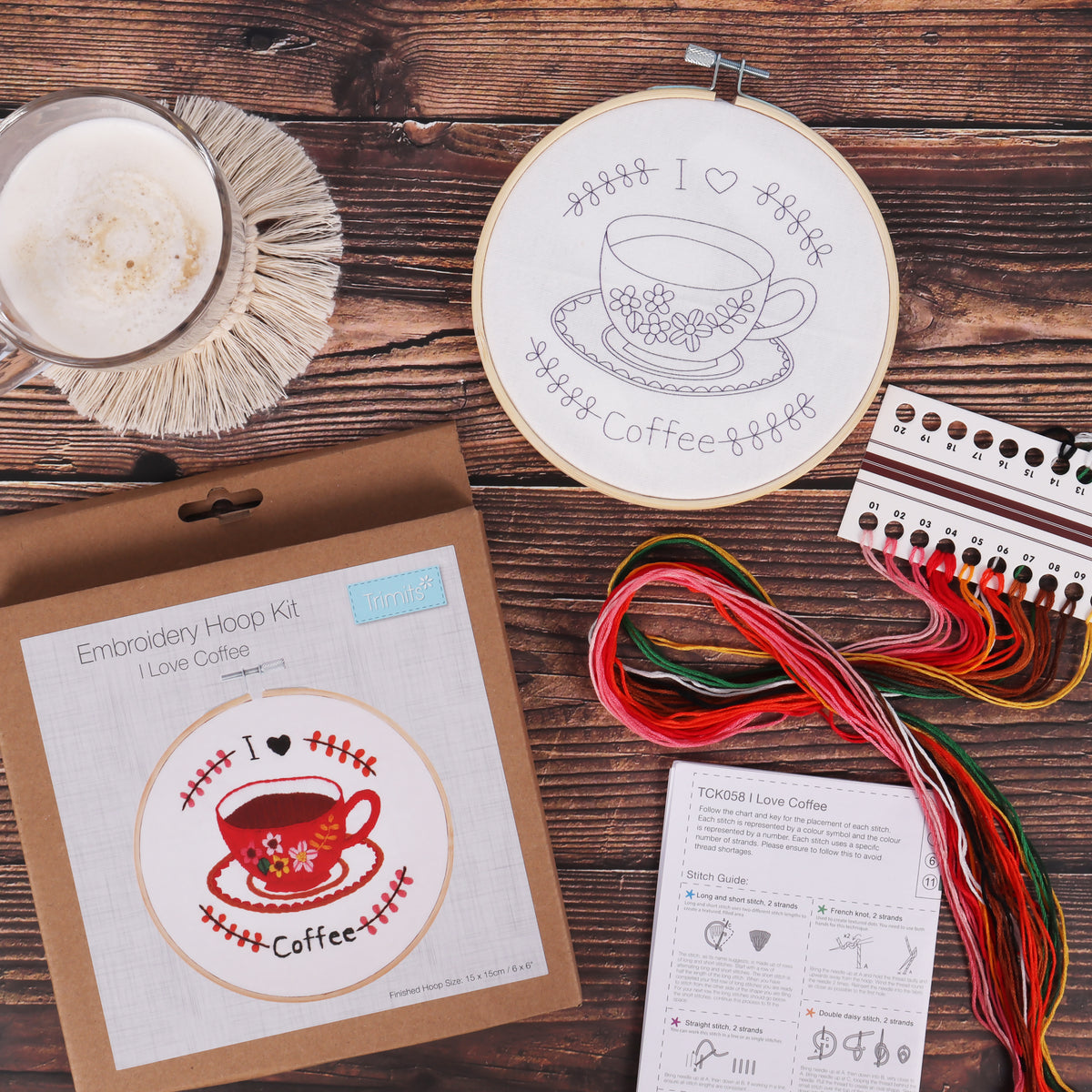 Embroidery hoop kit showing a stitched i love coffee design