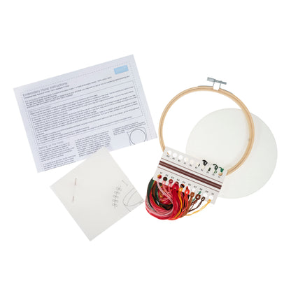 Embroidery hoop kit showing a stitched i love coffee design