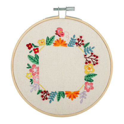 Finished floral photo frame embroidery in a 15cm bamboo hoop