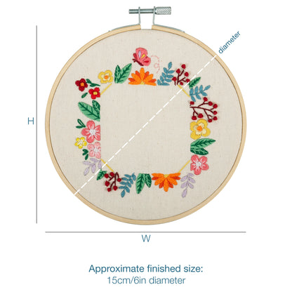 Finished floral photo frame embroidery in a 15cm bamboo hoop