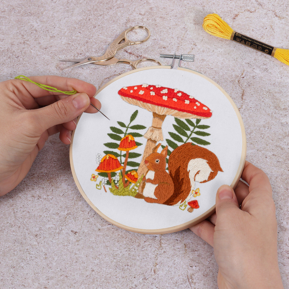 Finished toadstool squirrel embroidery in a 15cm bamboo hoop