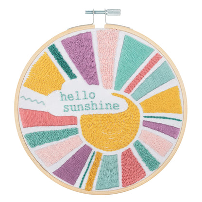 Finished rainbow embroidery in a 15cm bamboo hoop