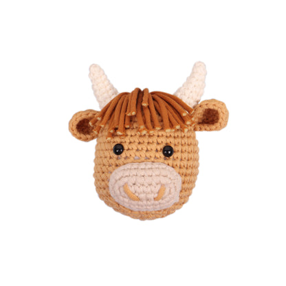 Crocheted amigurumi highland cow