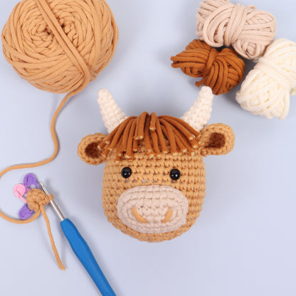 Crocheted amigurumi highland cow