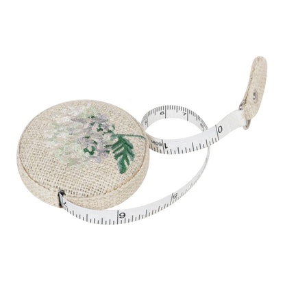 Round retractable tape measure with embroidered hydrangea flower on top