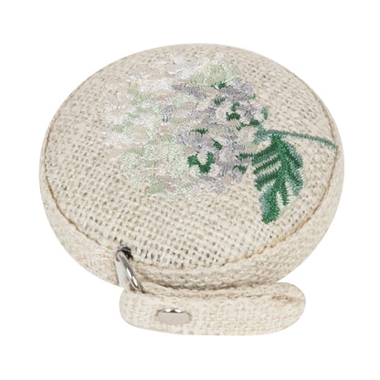 Round retractable tape measure with embroidered hydrangea flower on top