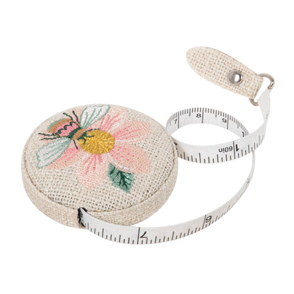 Retractable tape measure with embroidered patchwork bee