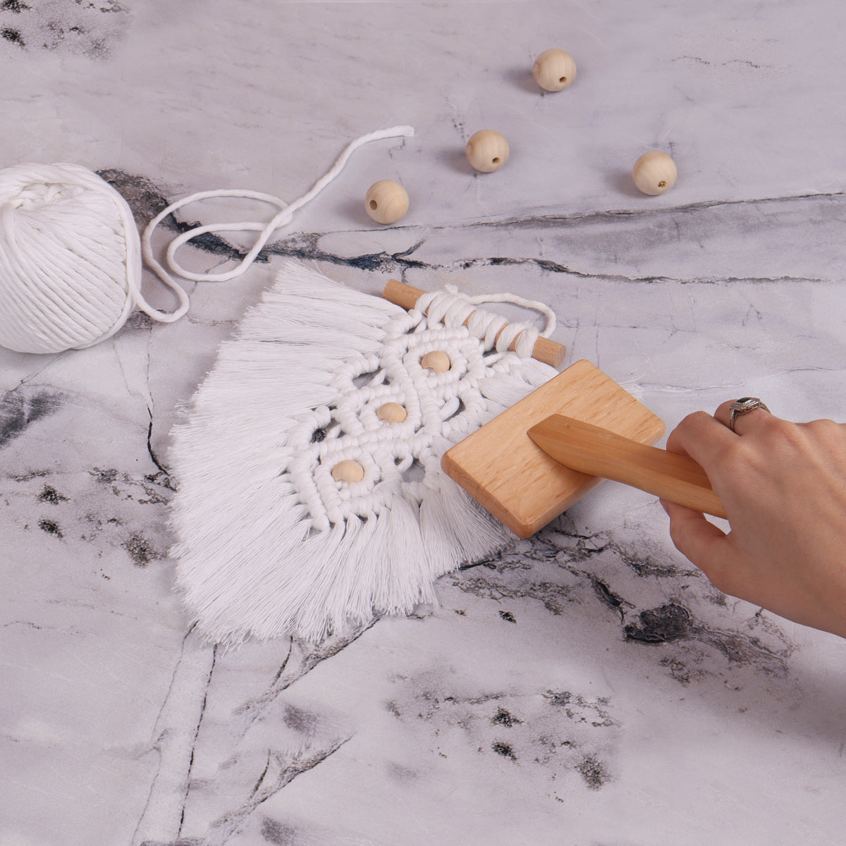 Macrame brush with steel teeth and ergonomic handle