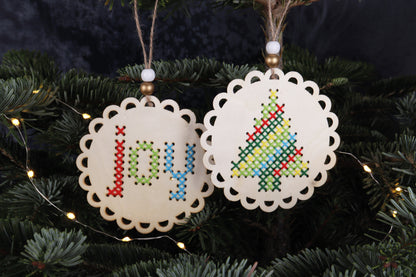 Pre-punched wooden Joy and Christmas tree shapes for cross stitch