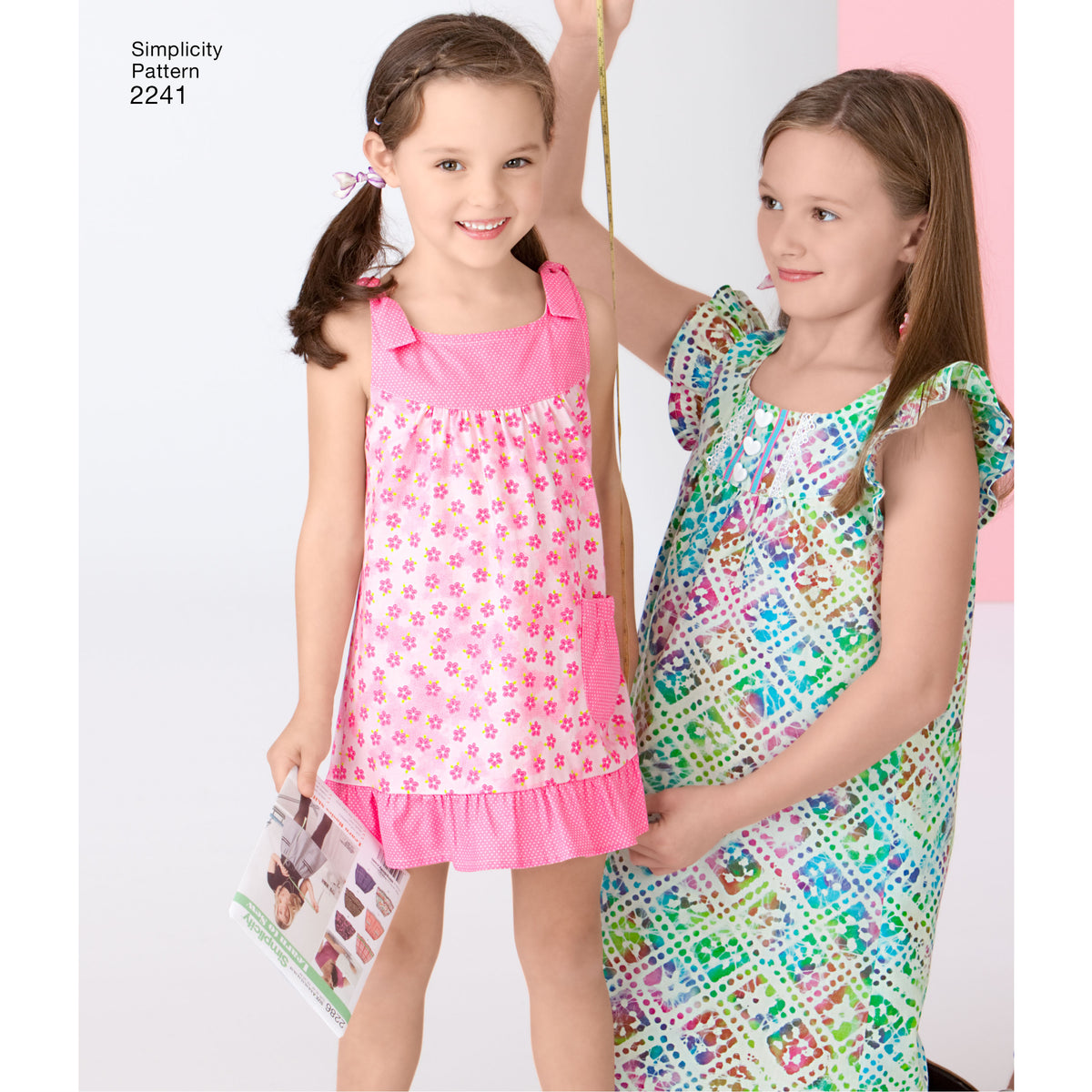 Simplicity S2241 sewing pattern envelope showing learn to sew child's and girls' dress
