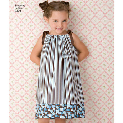 Simplicity S2391 sewing pattern envelope showing child's dress, tops, trousers and bag