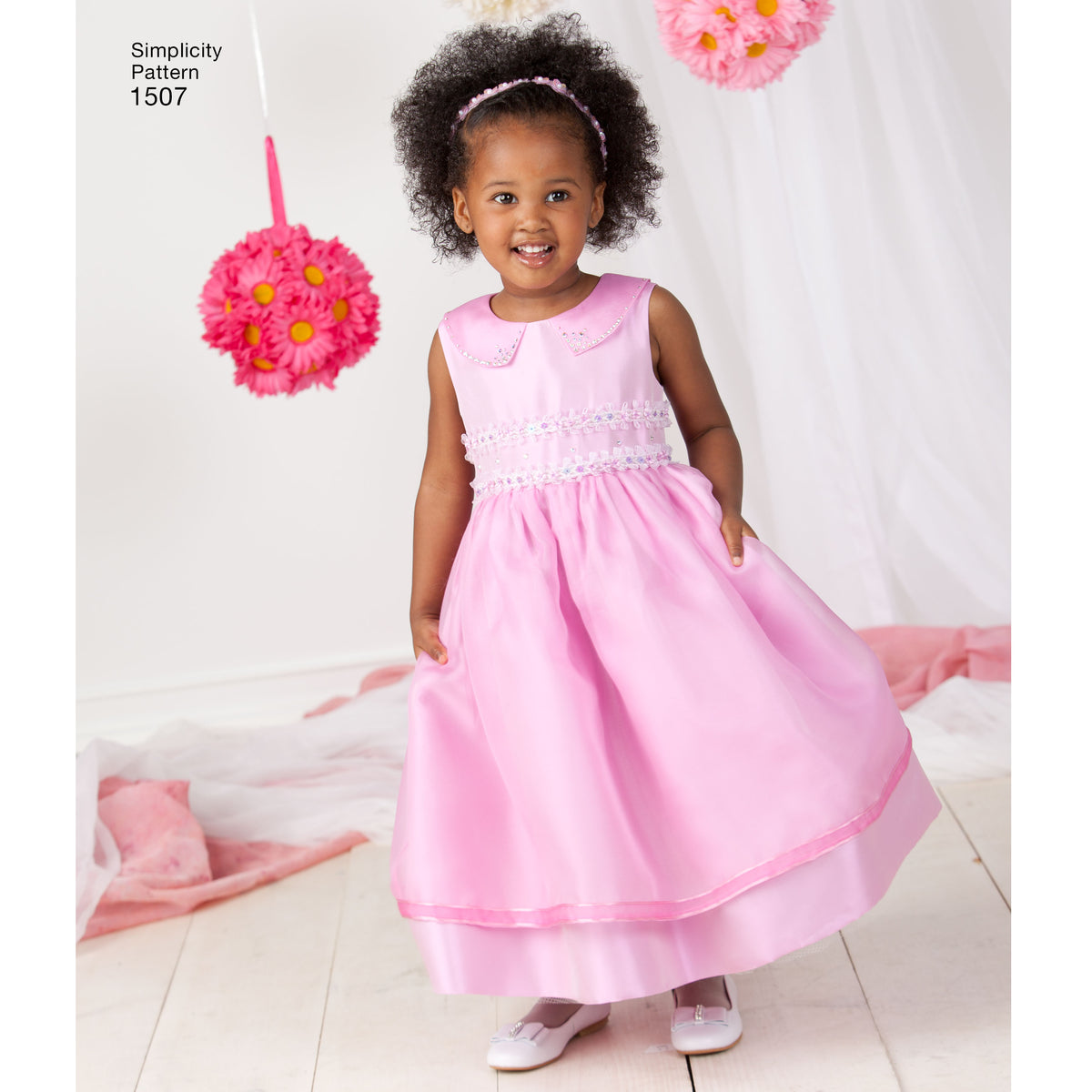 Simplicity 1507 pattern envelope showing toddler dresses