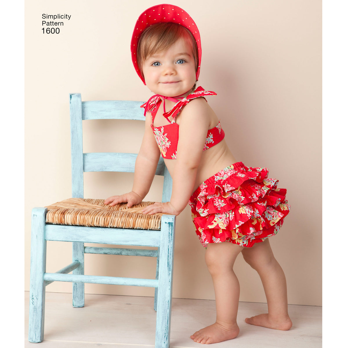 Simplicity S1600 sewing pattern envelope showing vintage baby romper and bonnet