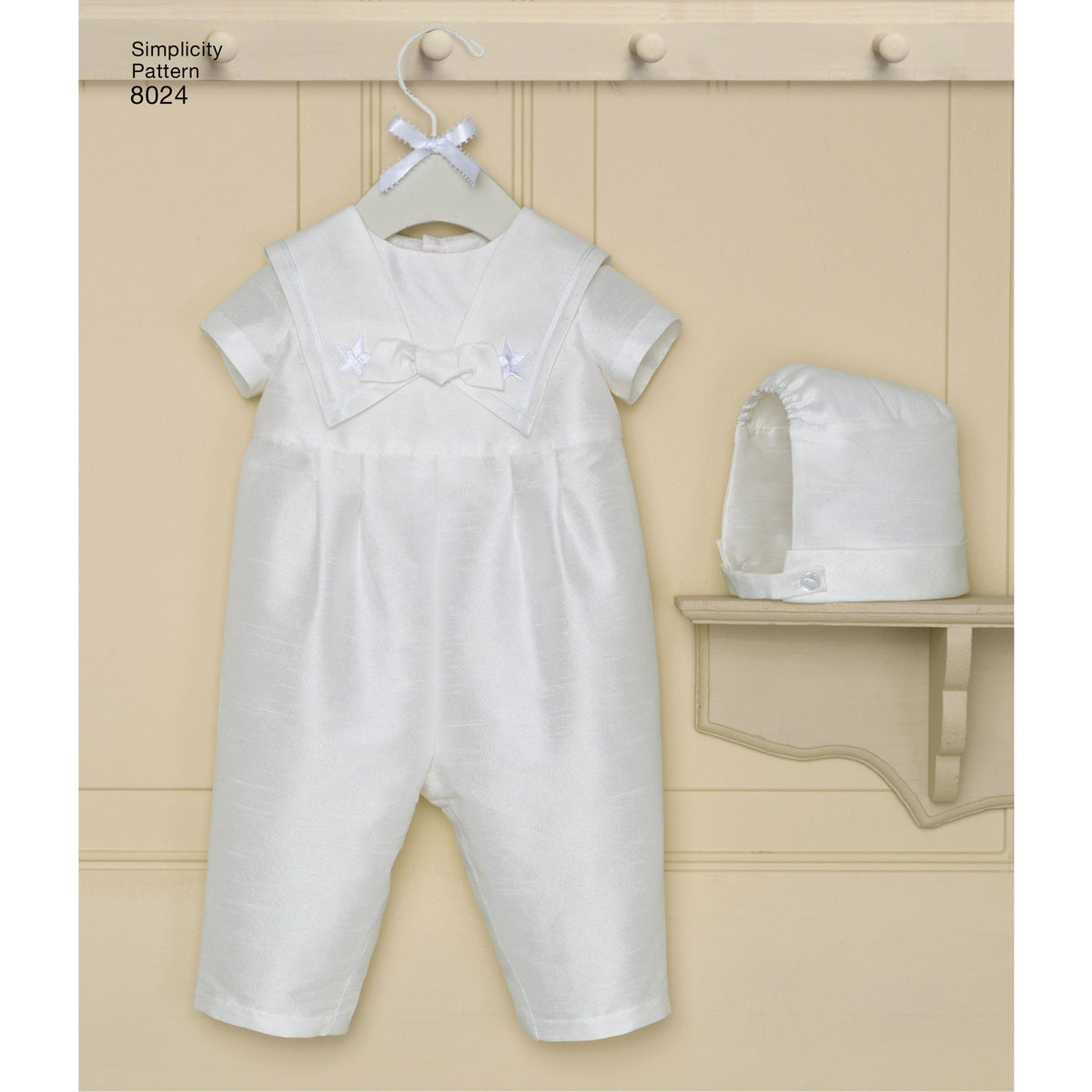 Simplicity S8024 sewing pattern envelope showing baby christening gown