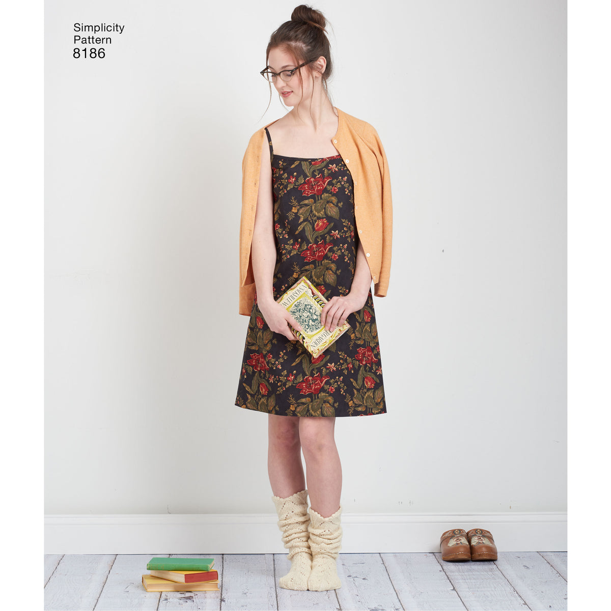 Simplicity 8186 sewing pattern envelope showing dottie angel wrap and slip dress designs