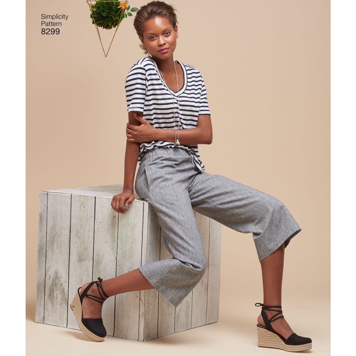 Simplicity S8299 sewing pattern envelope showing skirt and trousers