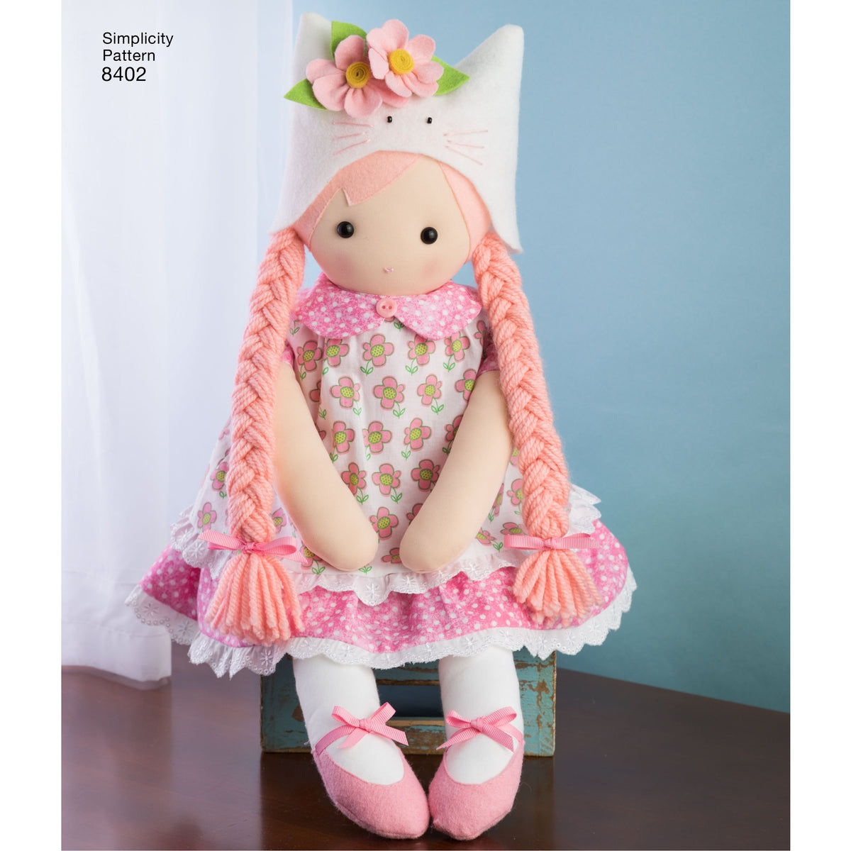 Simplicity S8402 sewing pattern envelope showing stuffed dolls with clothes