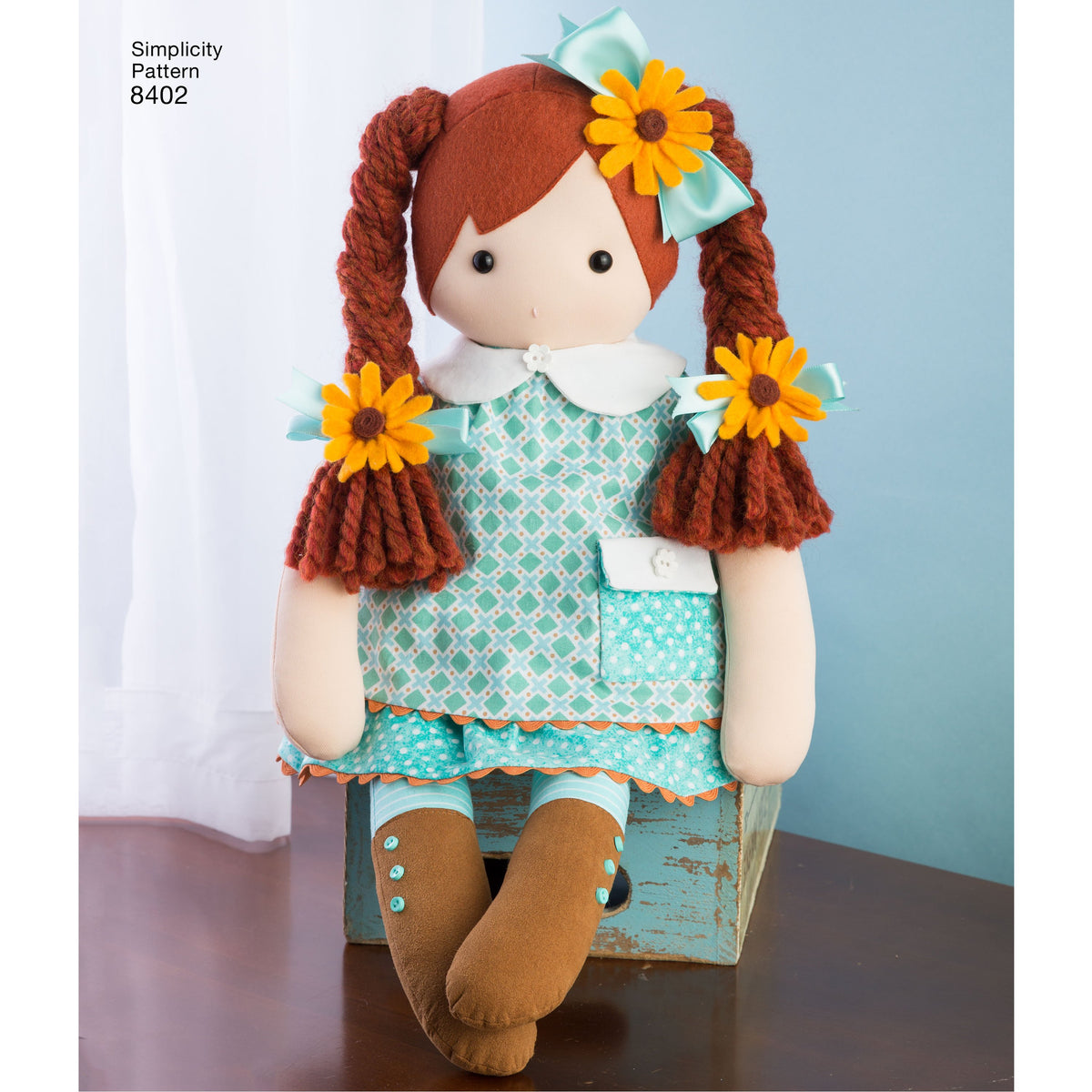 Simplicity S8402 sewing pattern envelope showing stuffed dolls with clothes