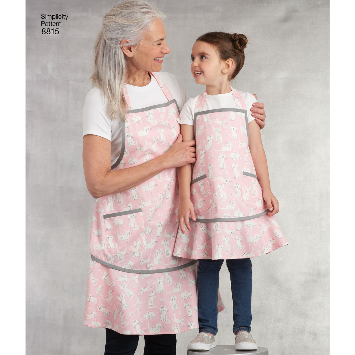Simplicity S8815 sewing pattern envelope showing child & misses' matching aprons