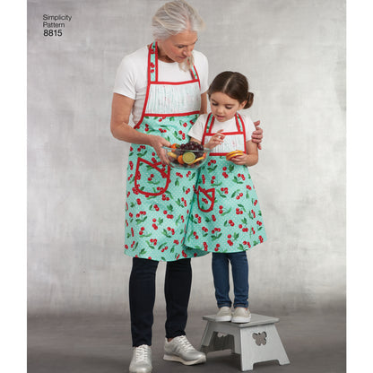 Simplicity S8815 sewing pattern envelope showing child & misses' matching aprons