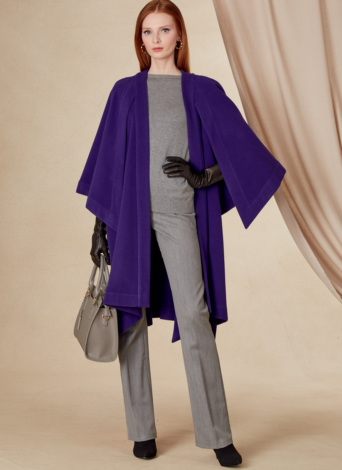 Vogue Patterns V1818 envelope showing a loose-fitting unlined cape