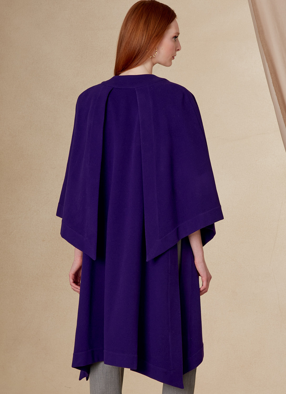 Vogue Patterns V1818 envelope showing a loose-fitting unlined cape