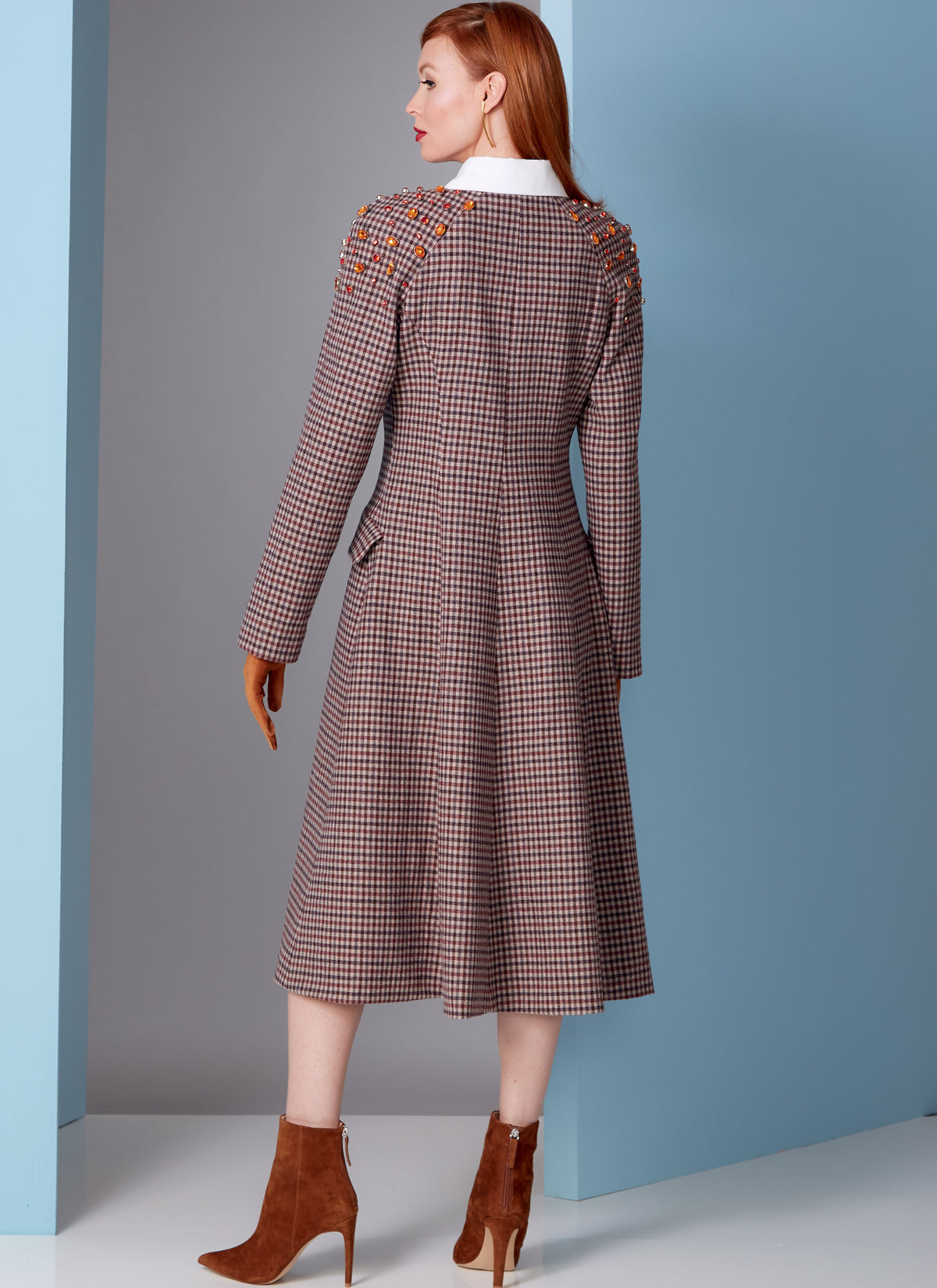 Vogue Patterns V1836 envelope showing a lined coat, loose-fitting through the bust and waist