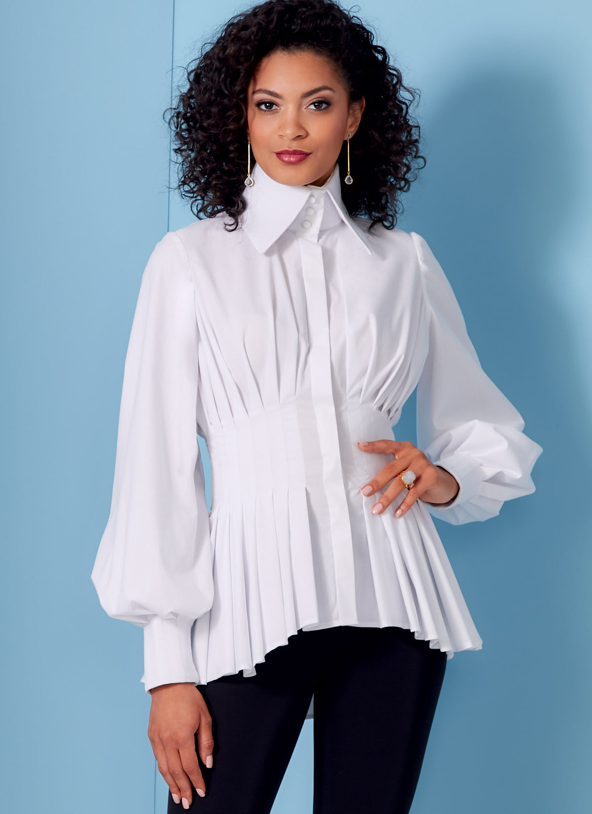 Vogue Patterns V1845 envelope showing a peplum shirt, fitted through the bust and waist