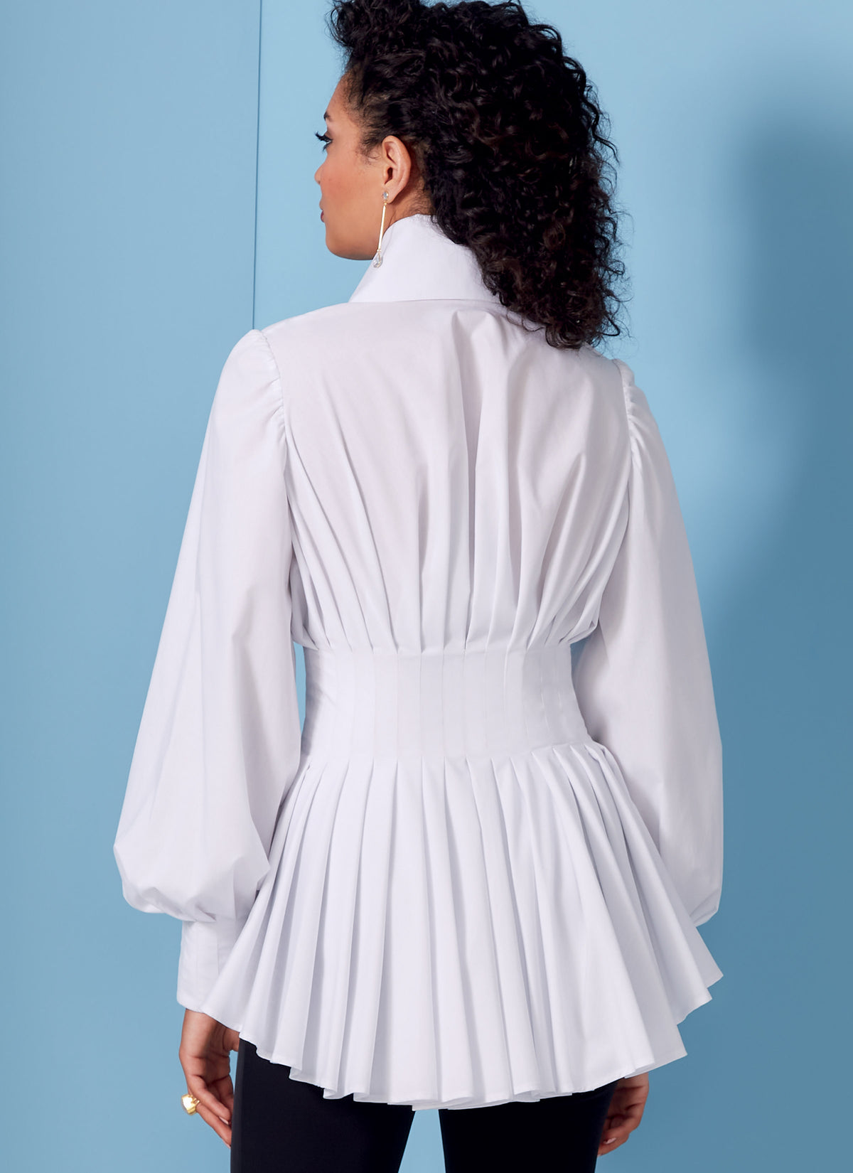 Vogue Patterns V1845 envelope showing a peplum shirt, fitted through the bust and waist