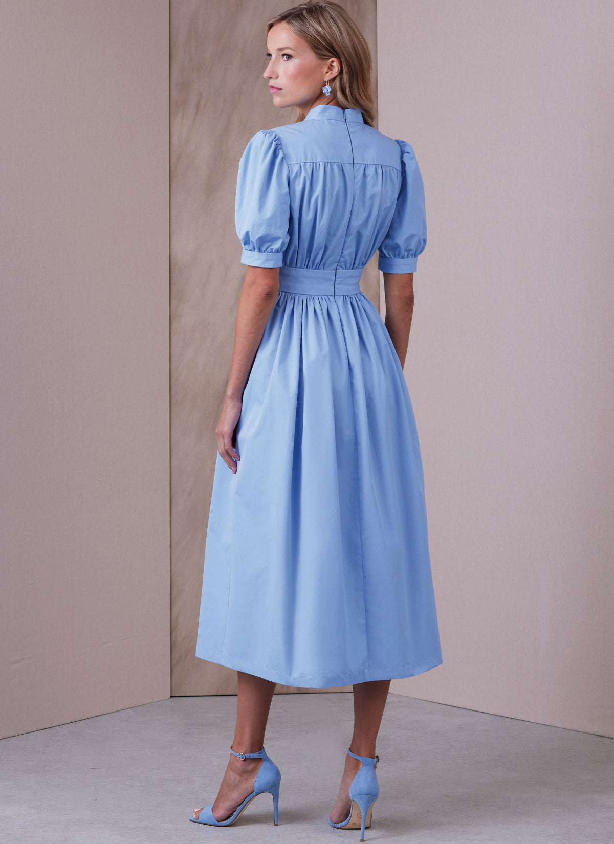 Vogue Patterns V1934 envelope showing the dress with a stand collar and raised waist