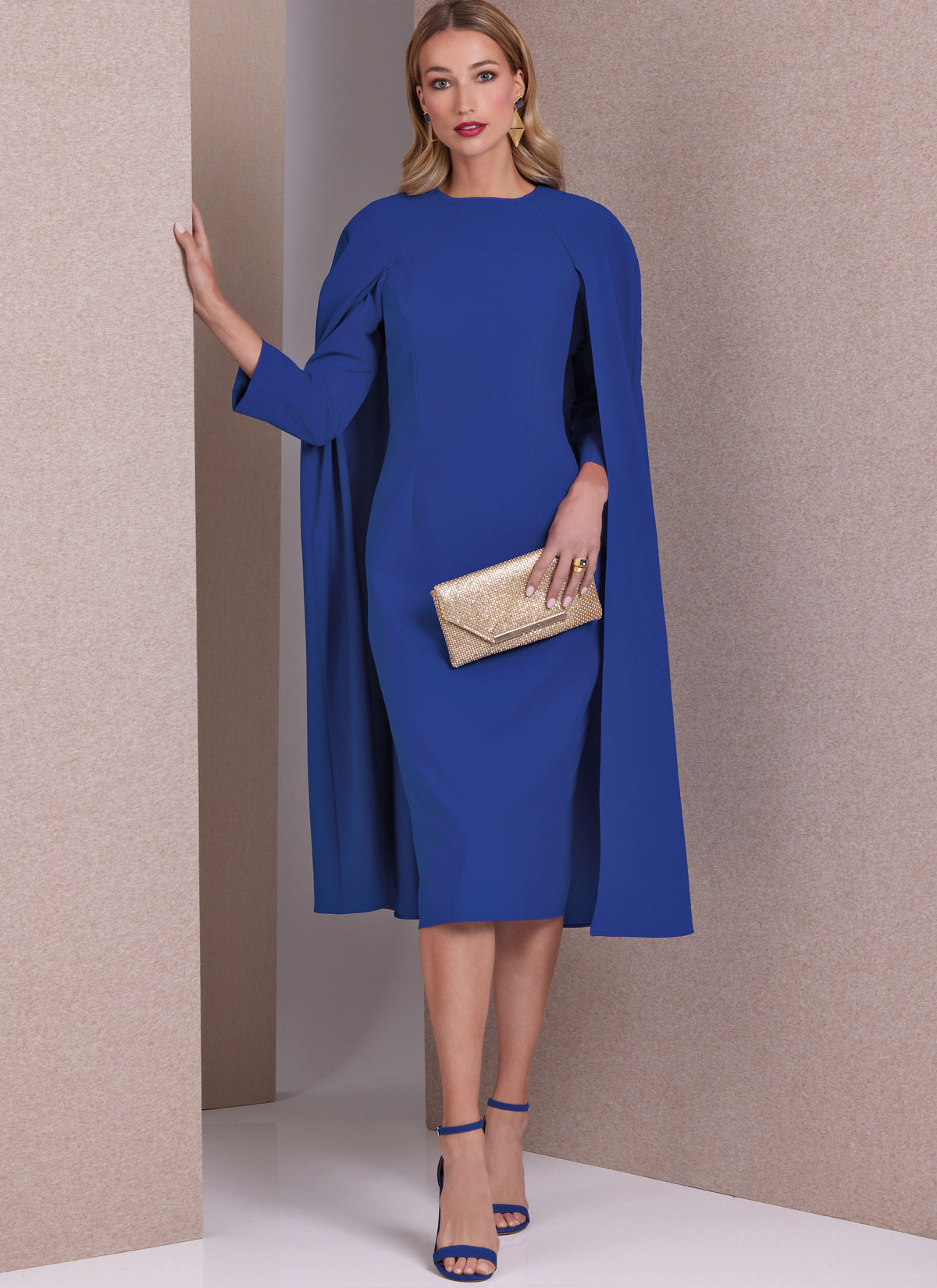 Vogue Patterns V1982 envelope showing lined cape dress designs