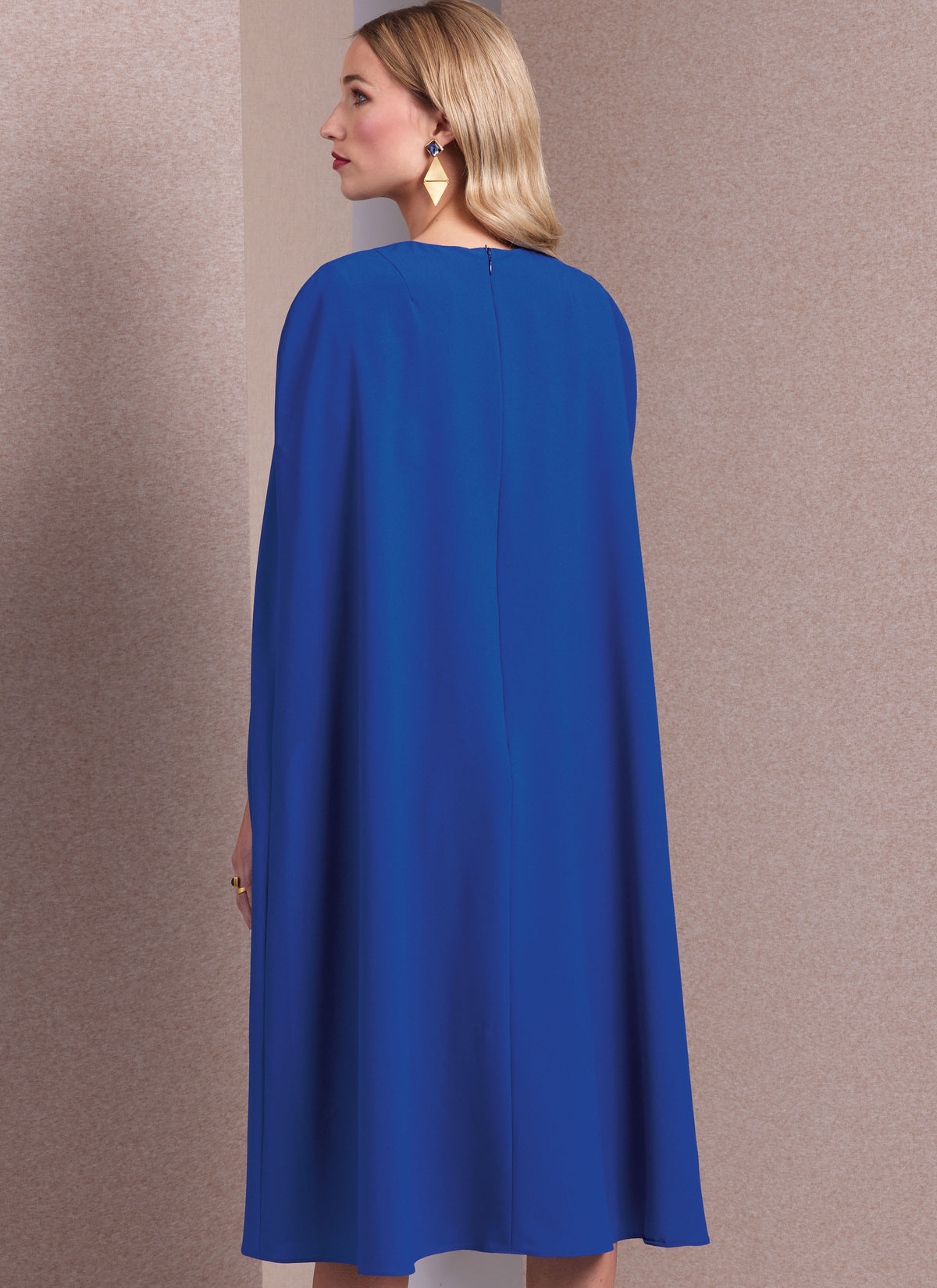 Vogue Patterns V1982 envelope showing lined cape dress designs